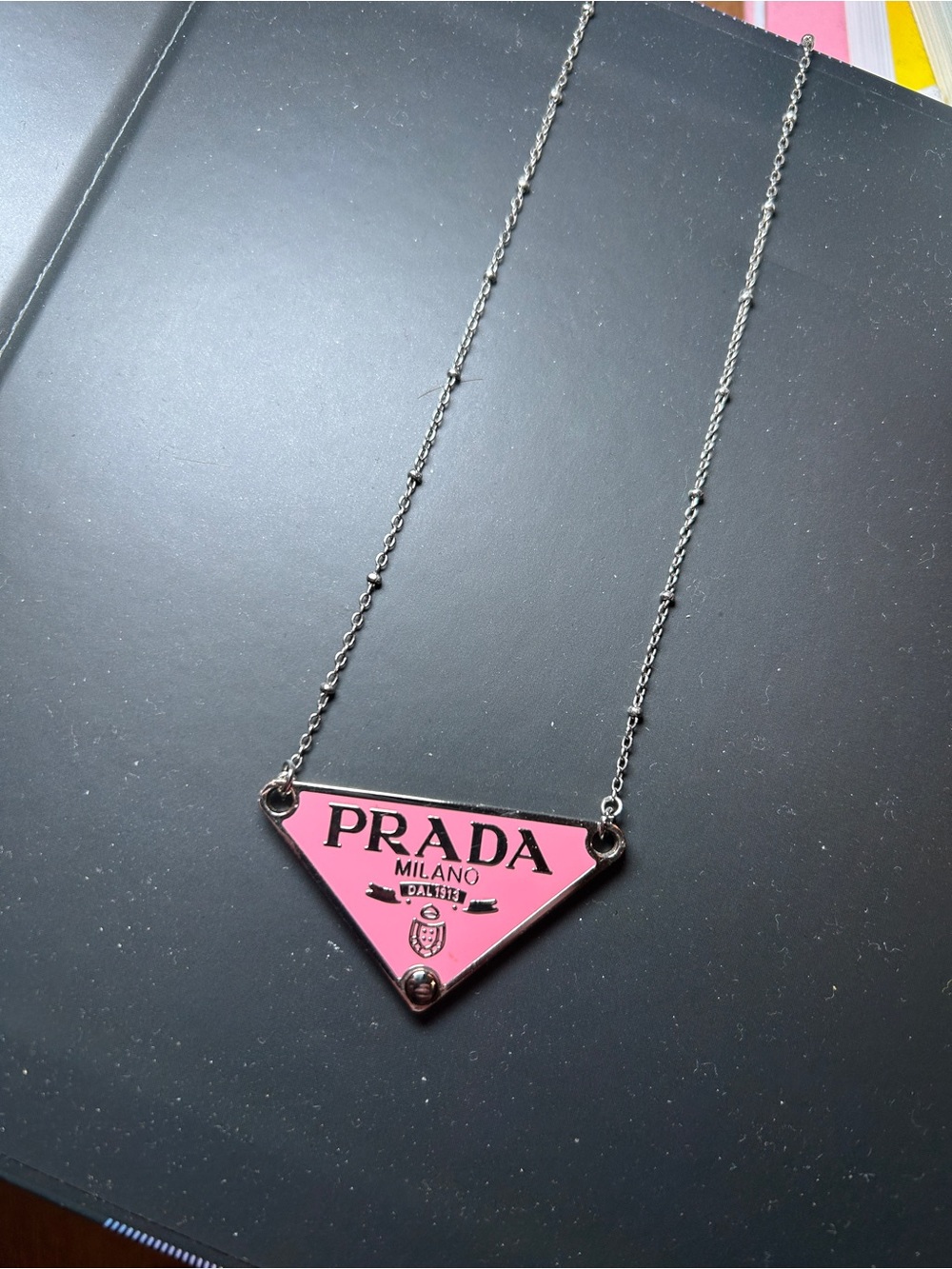 Prada Pink Enamel Triangle Logo Necklace stamped on the back with basic chain